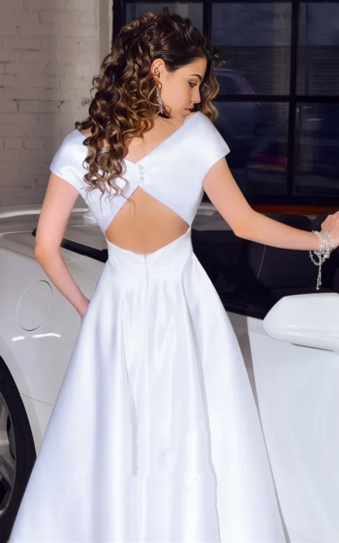 Side view of A-line V-neck satin tea-length wedding dress with sash.