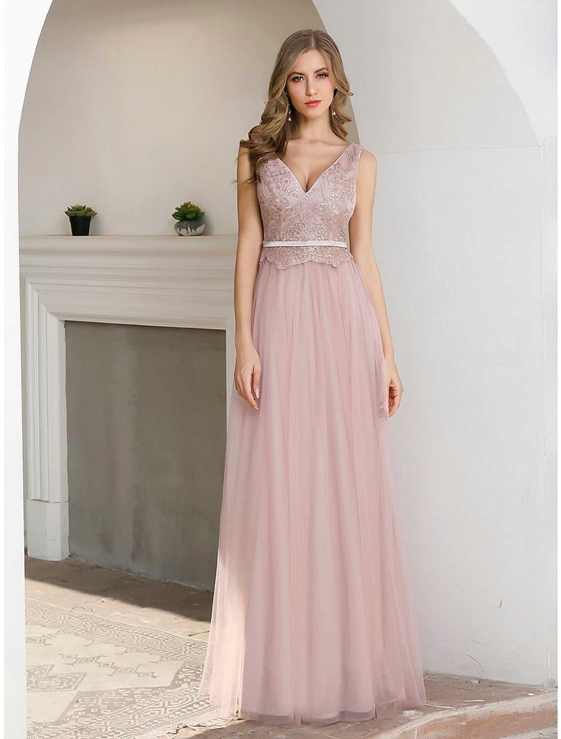Elegant A-Line evening gown with V-neckline and sequin details.
