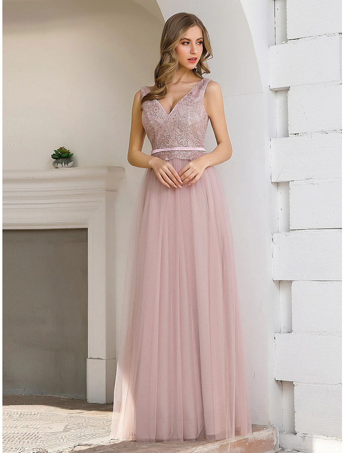 Back view of the A-Line evening gown featuring a V-back and sash.