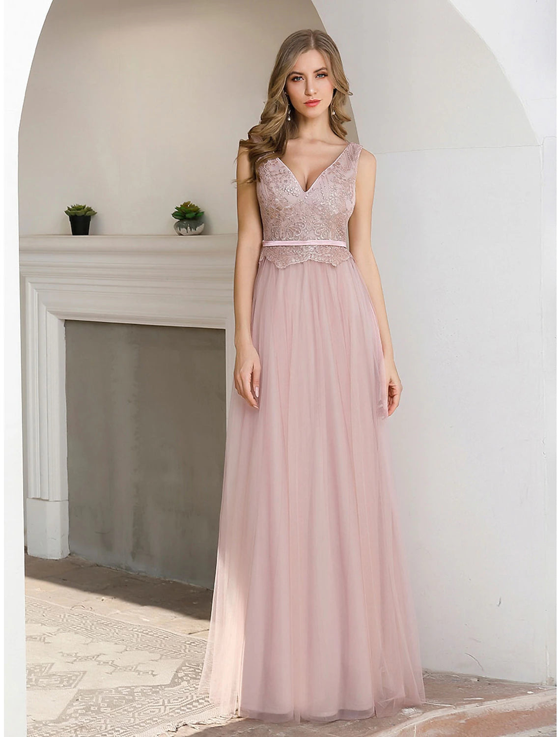 Detail of the luxurious satin fabric and flowing skirt of the gown.