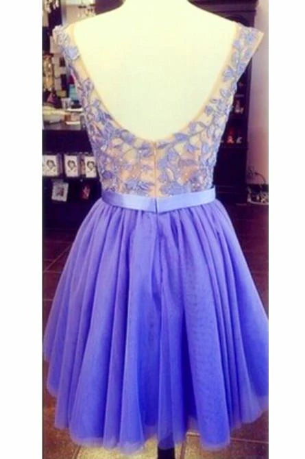 Close-up of the lace detail on a short V-neck A-line dress.