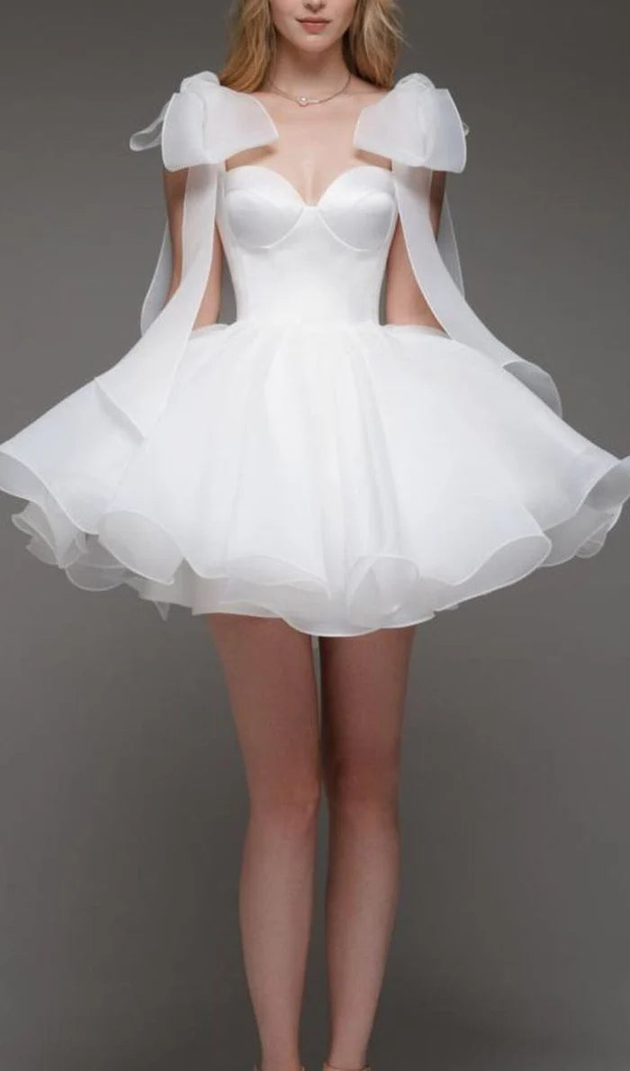 Full length view of a woman wearing the A-line V-neck homecoming dress.