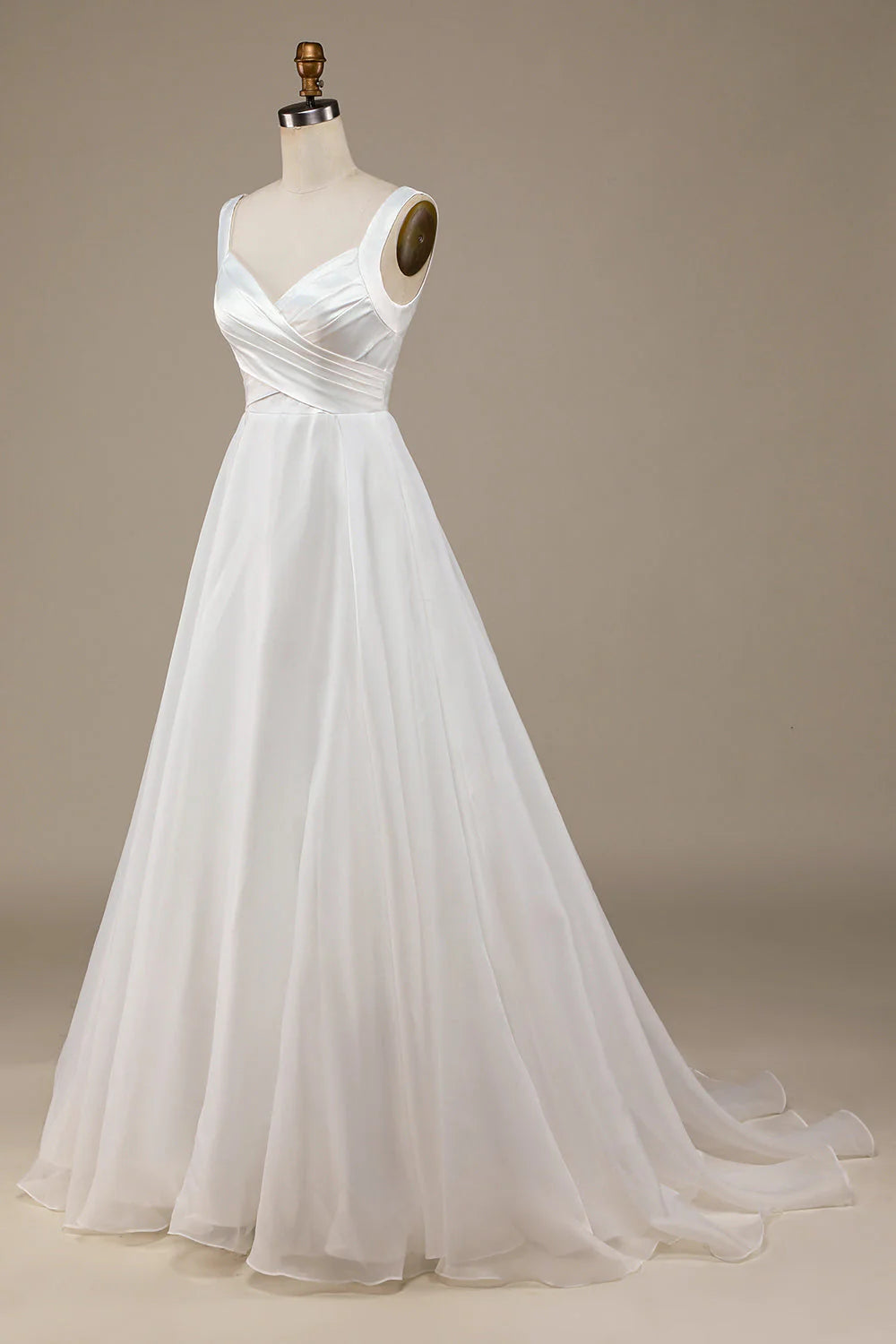 Side profile of the ivory V-neck bridal gown.