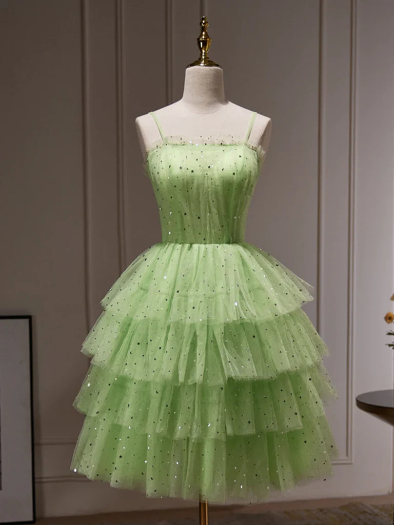 Woman wearing an elegant A-line V-neck tulle sequin formal dress.