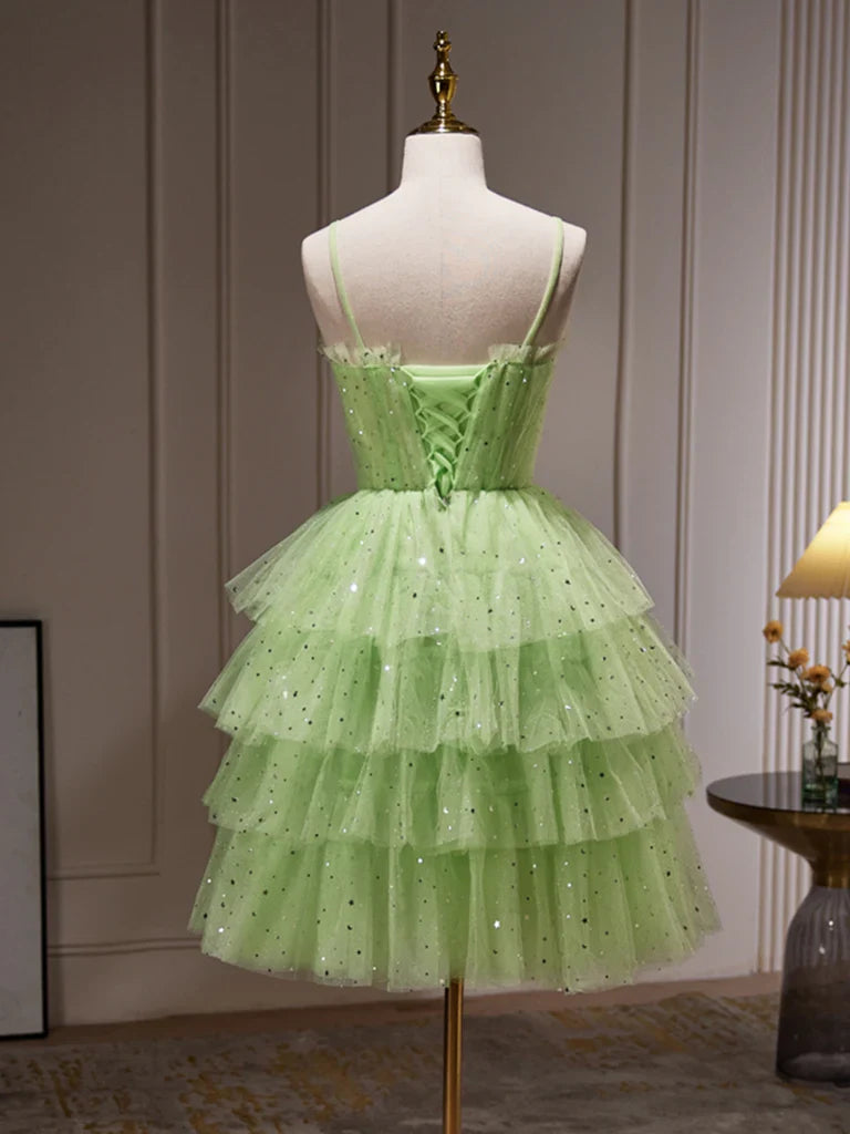 Back view of a woman in a sparkling A-line V-neck prom gown.