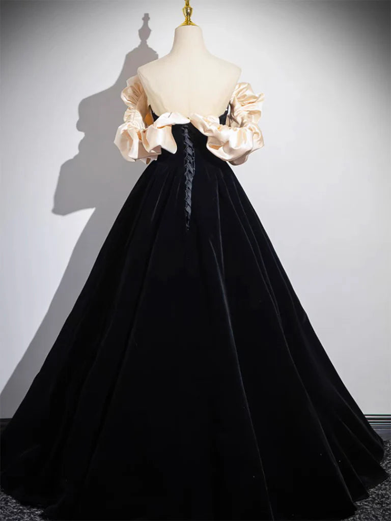 Back view of black A-line velvet prom dress.