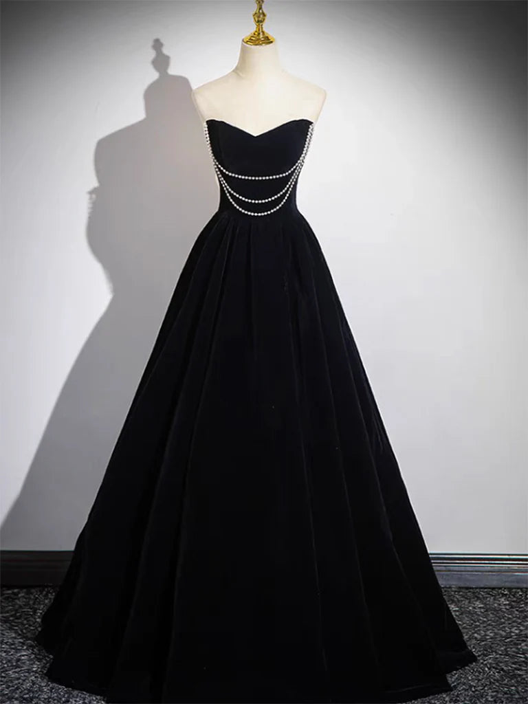 Side view of black A-line velvet long dress.