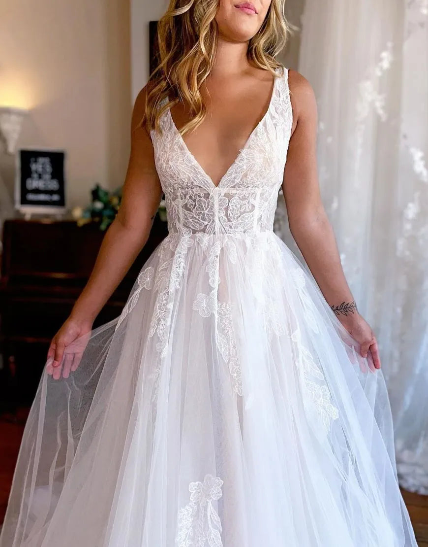 Side view of the elegant A-line wedding dress, showcasing the train.
