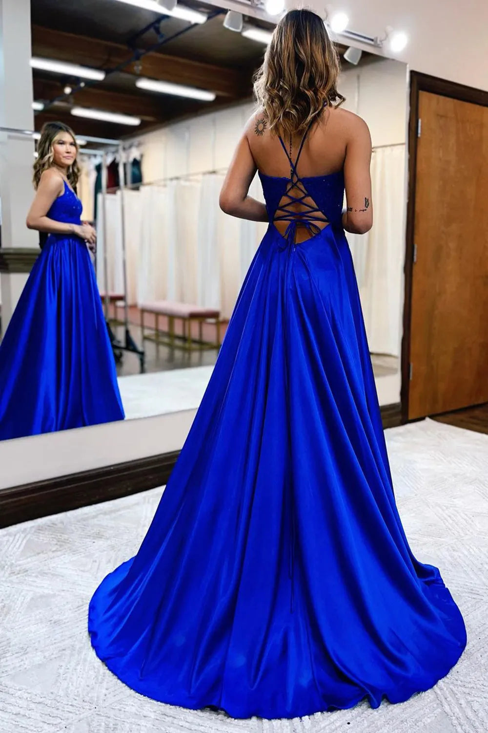 Side view of the elegant A-line gown, highlighting its silhouette.