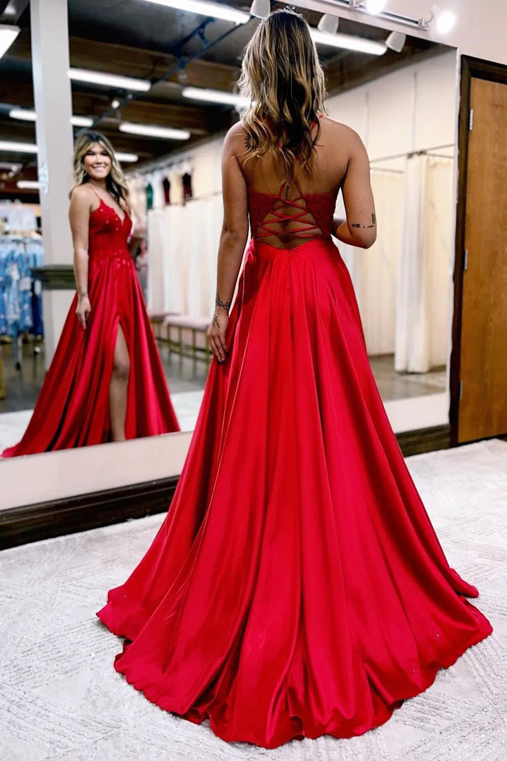 Detail of the long skirt and hem of the A-line prom dress.