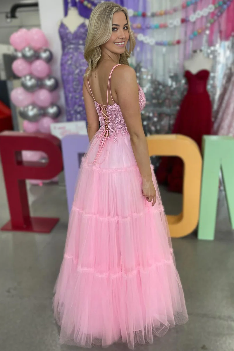 Back view of pink A-line prom dress showing flowing tulle skirt.