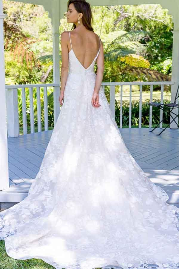 Back view of the A-line lace wedding dress showing spaghetti straps.