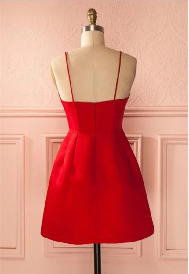 Back view of a short A-line dress featuring a backless design and spaghetti straps.