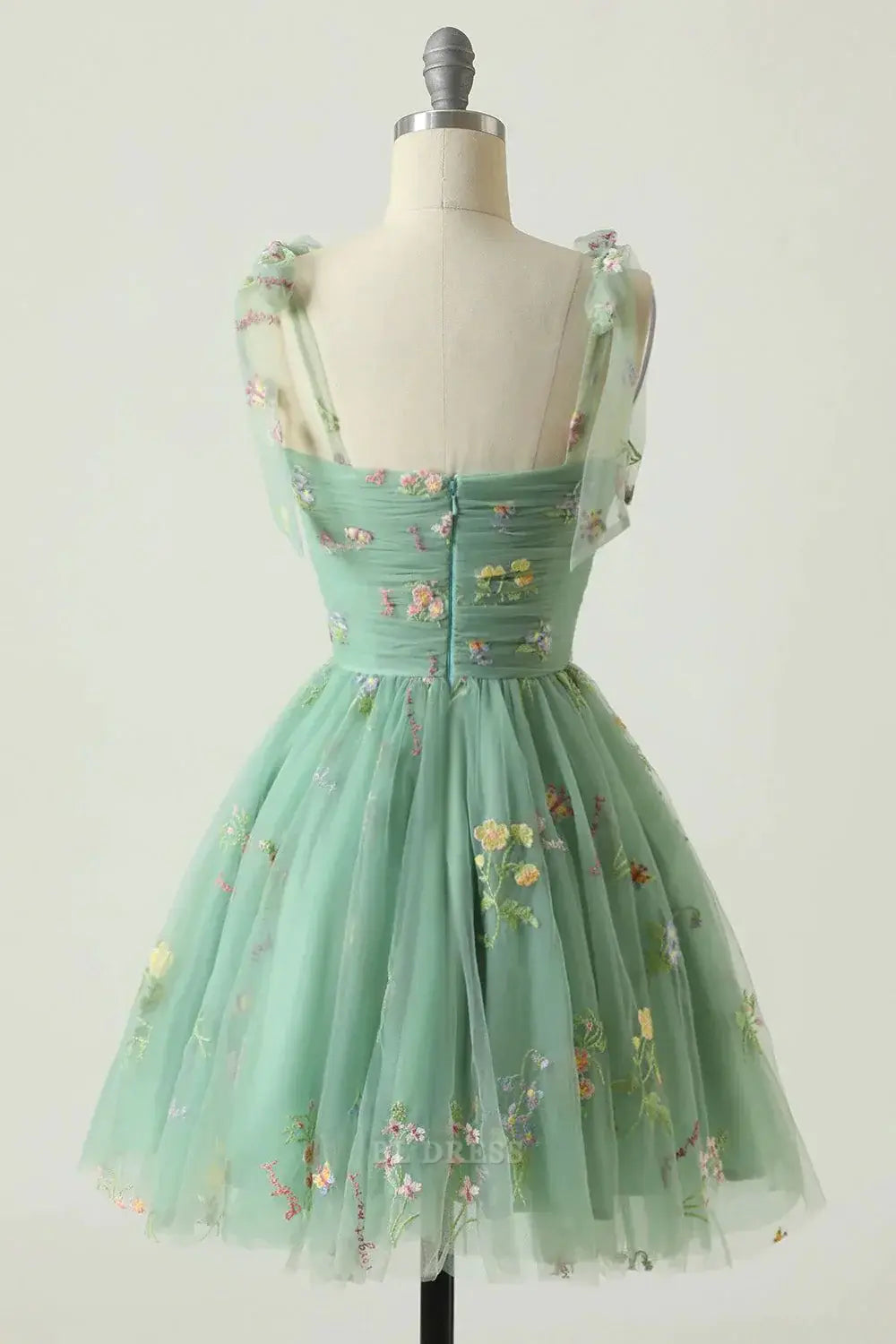 Champagne A-line short dress with spaghetti straps, side view.