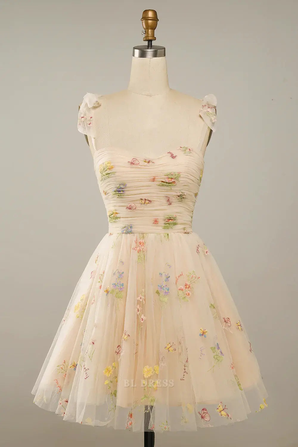 Champagne A-line short dress with spaghetti straps, back view.
