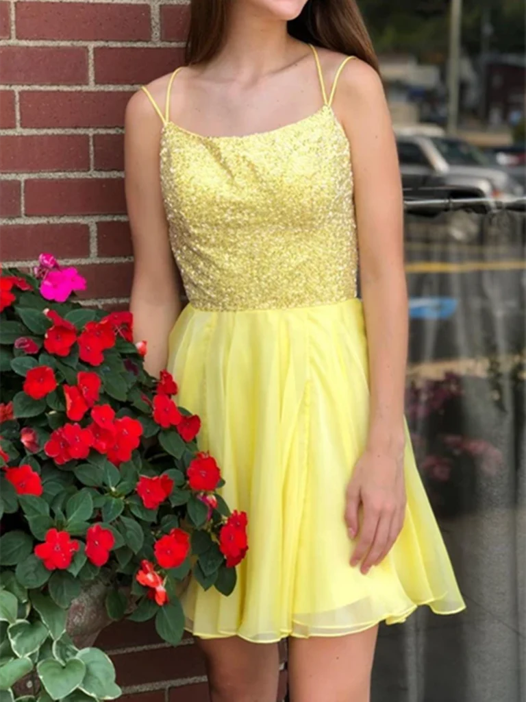Aqua A-line chiffon homecoming dress with spaghetti straps and V-neck.