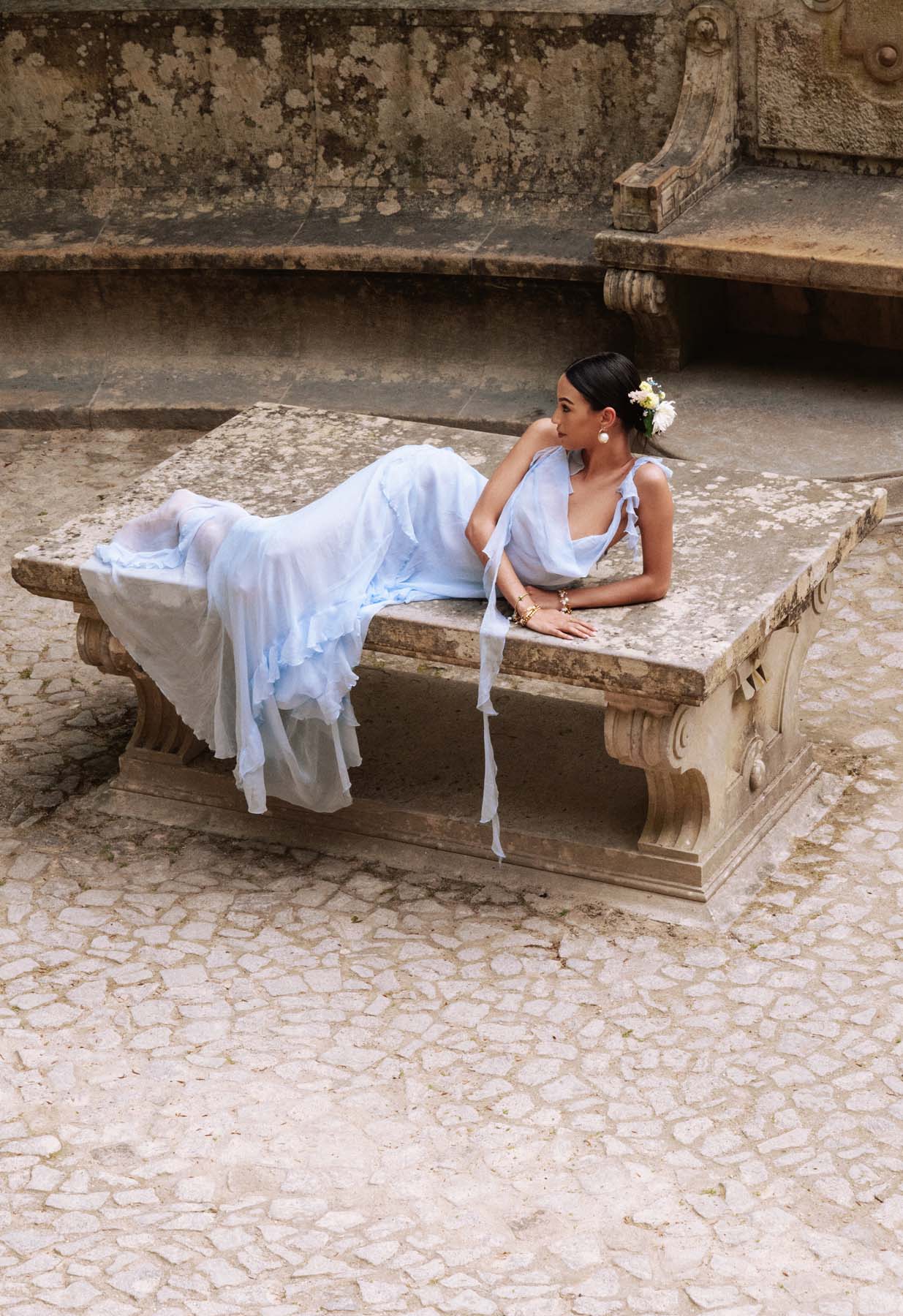 Side profile of a sleeveless A-line formal gown.
