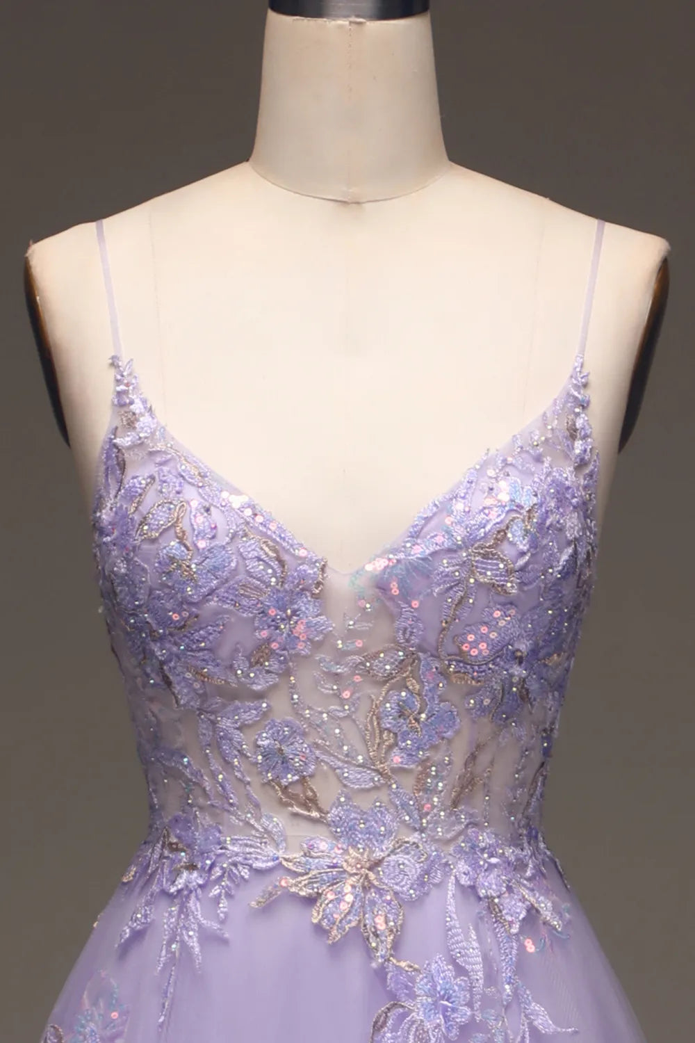 Side profile of the elegant A-line spaghetti strap dress.