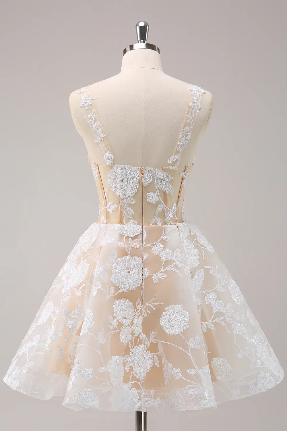 Back view of a white A-line short dress with corset lacing detail.
