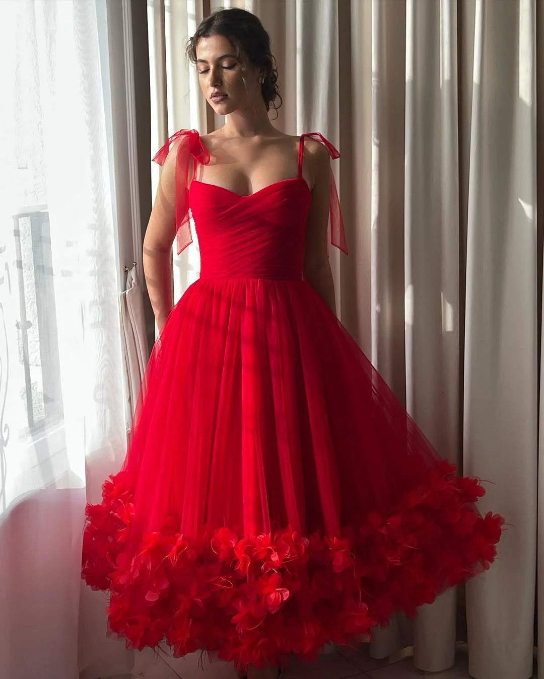 Elegant A-line V-neck prom dress with delicate spaghetti straps and floral embellishments.