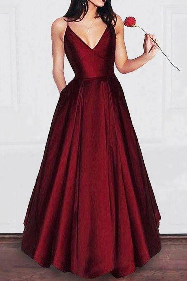 Elegant A-line V-neck spaghetti strap prom dress on a model.