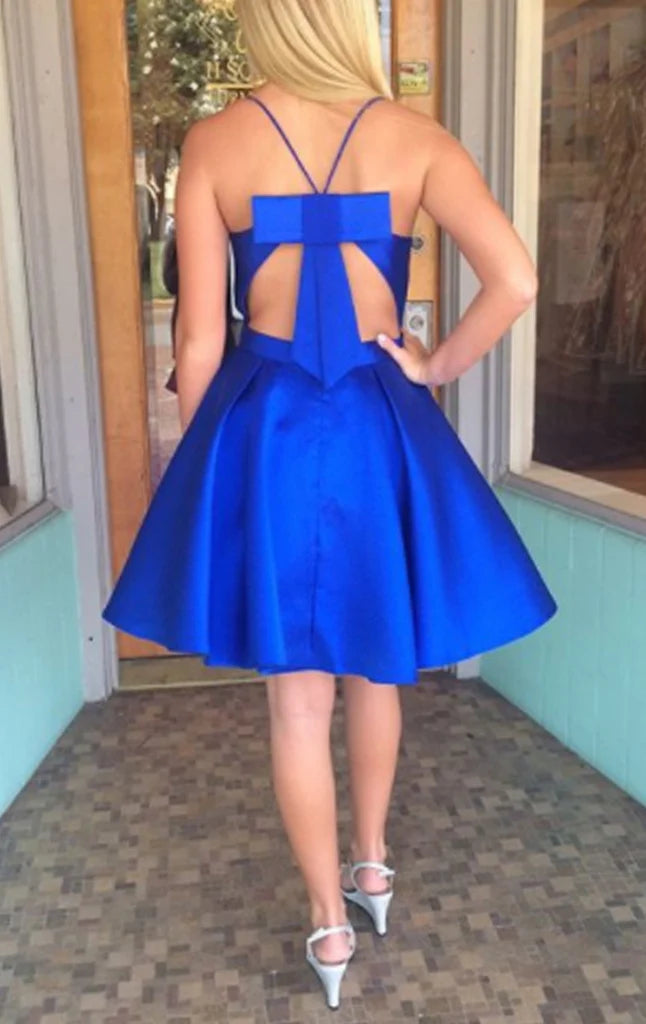 Full length view of a flowing A-line prom dress with V-neck and thin straps.