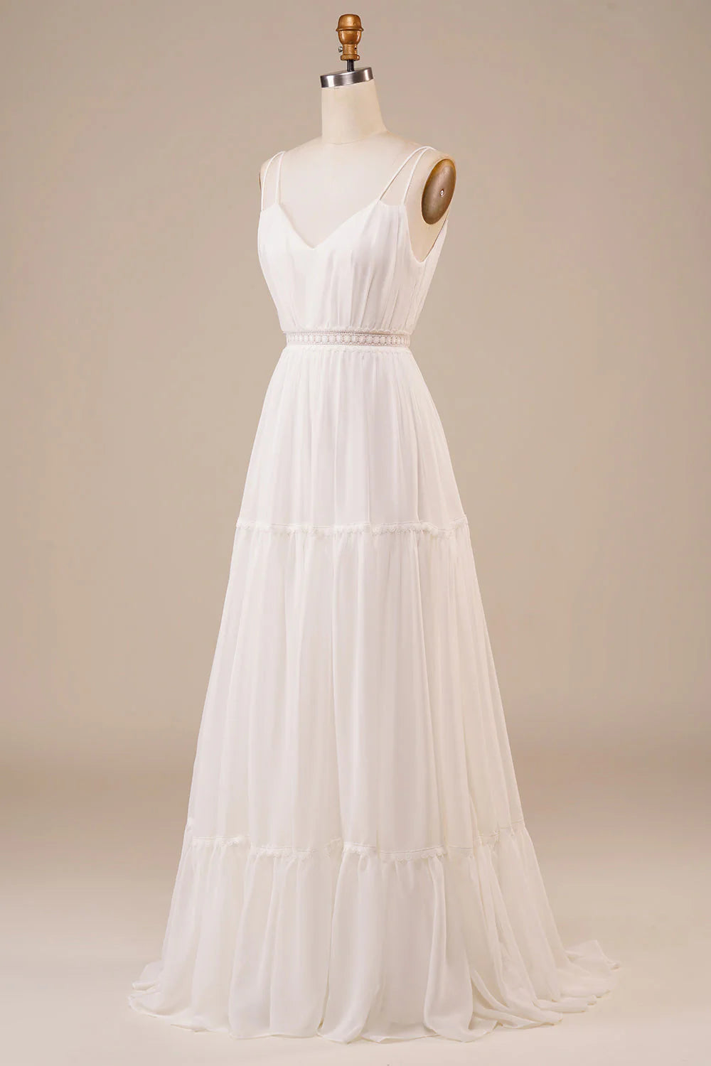 Side profile of a bride wearing an A-line V-neck wedding dress.