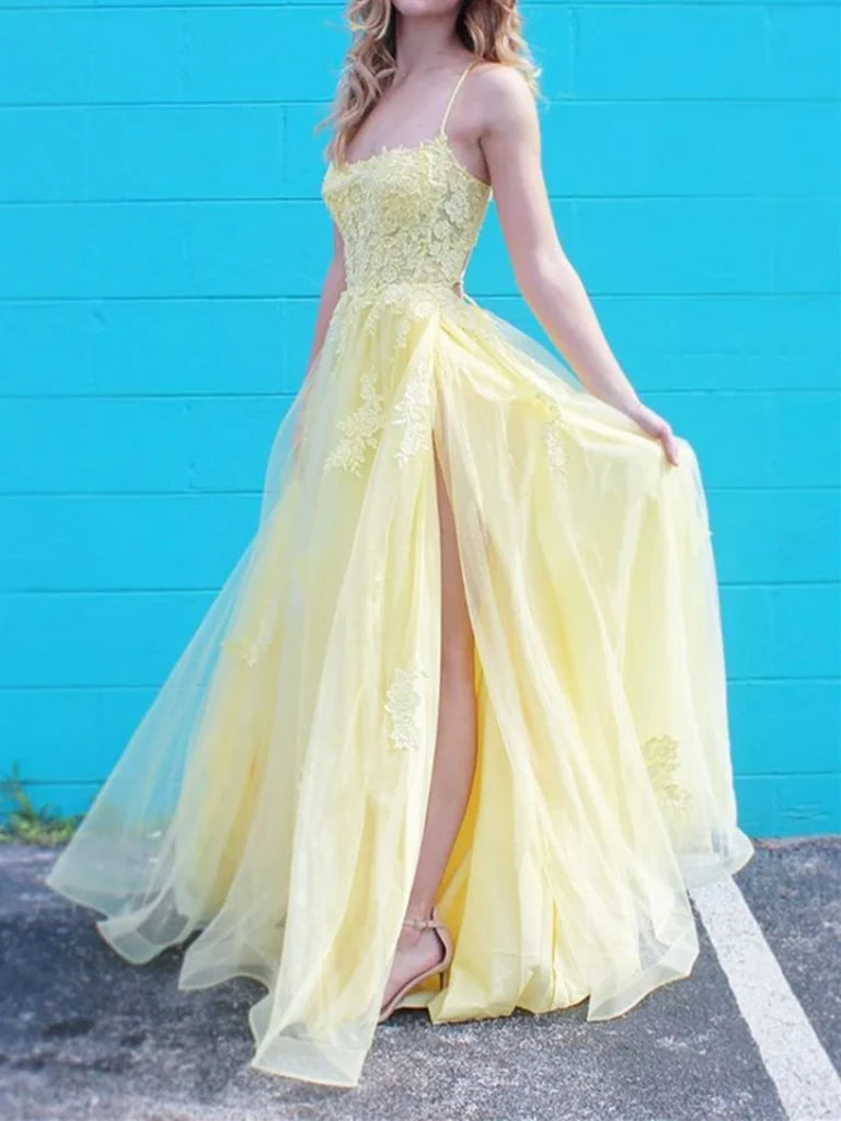 Elegant A-line lace prom dress with spaghetti straps and a thigh-high slit.