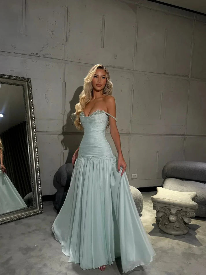 Back view of a model in the light sky blue A-line prom dress, showcasing the flowing skirt.