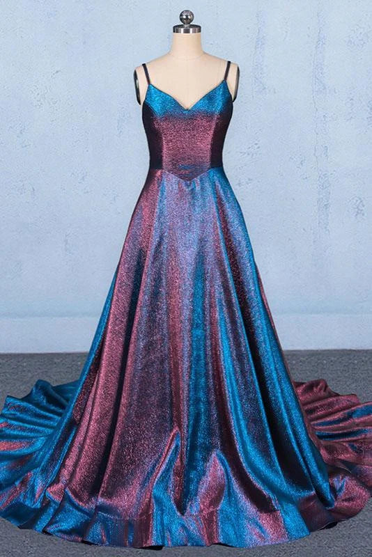 A woman wearing an elegant A-line V-neck spaghetti strap long prom dress.
