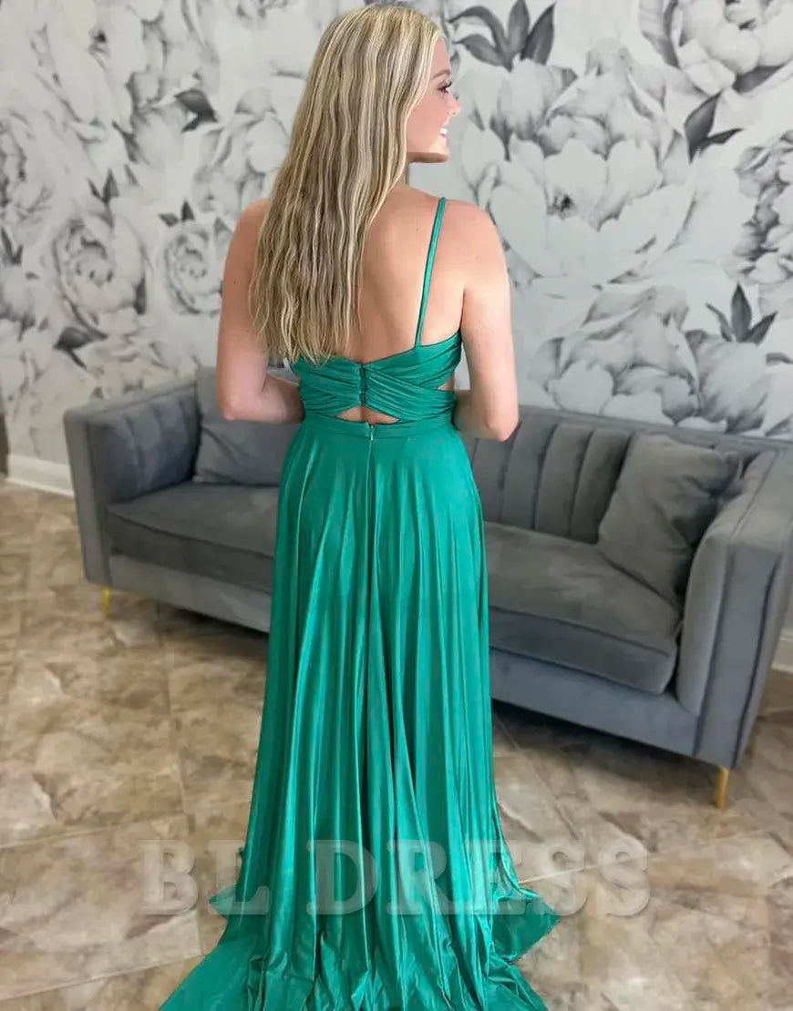 Side view of the green A-line dress, highlighting the flowing skirt and ruched detailing.
