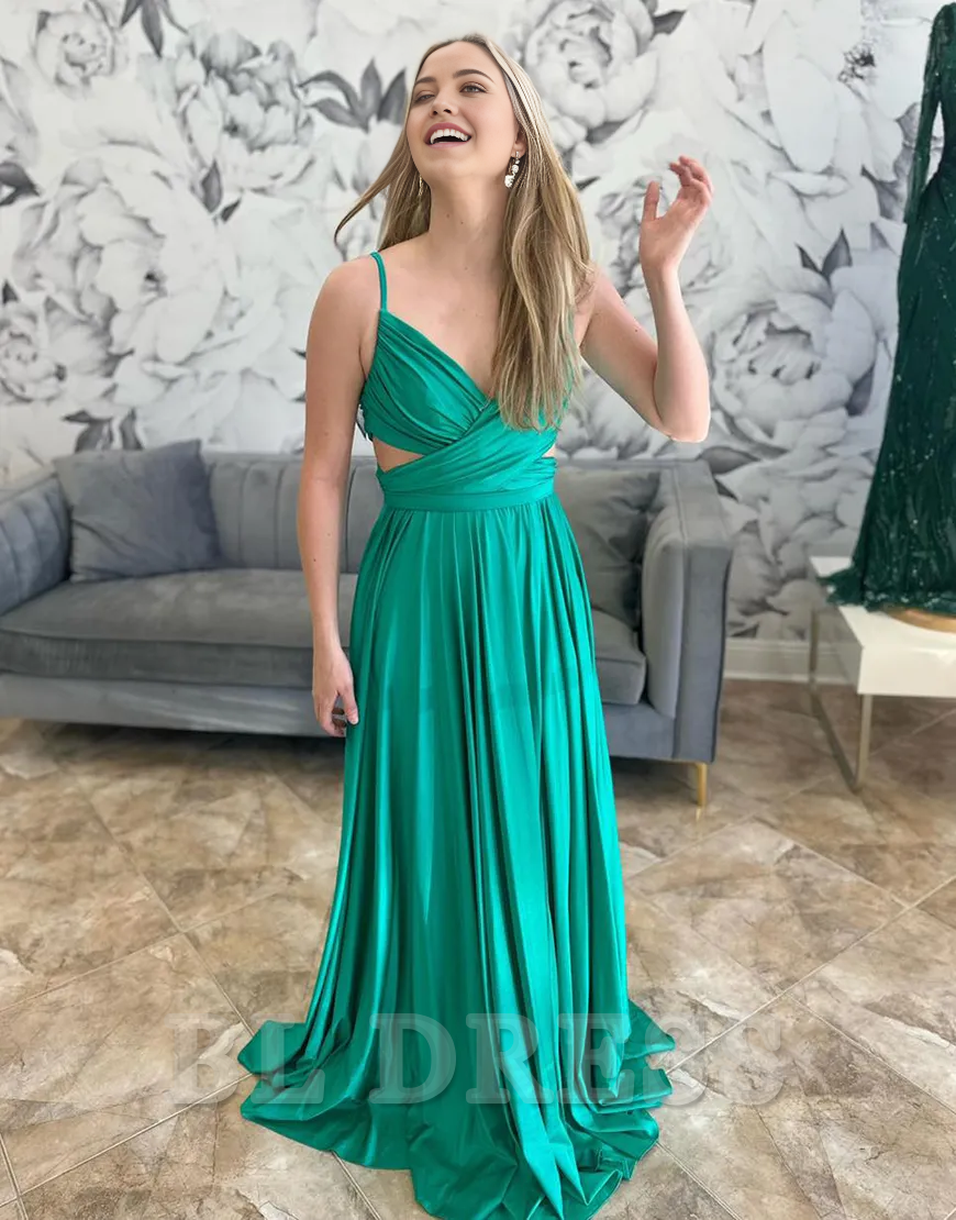 Back view of the long green formal dress, showing the delicate spaghetti straps and A-line silhouette.