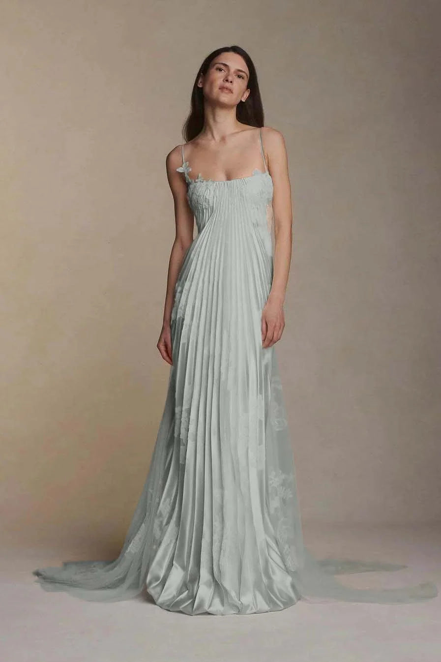 Back view of an A-line V-neck prom dress with spaghetti straps and ruched detailing.