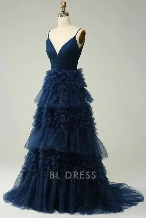 Side view of elegant navy evening gown with spaghetti straps.