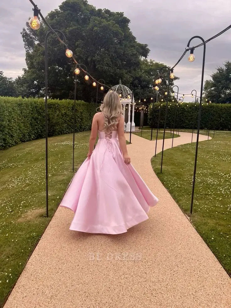 Pink A-line satin formal dress featuring a V-neck and delicate spaghetti straps.