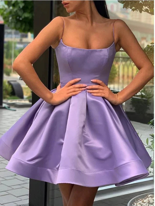 Elegant A-line short dress with V-neck and spaghetti straps.