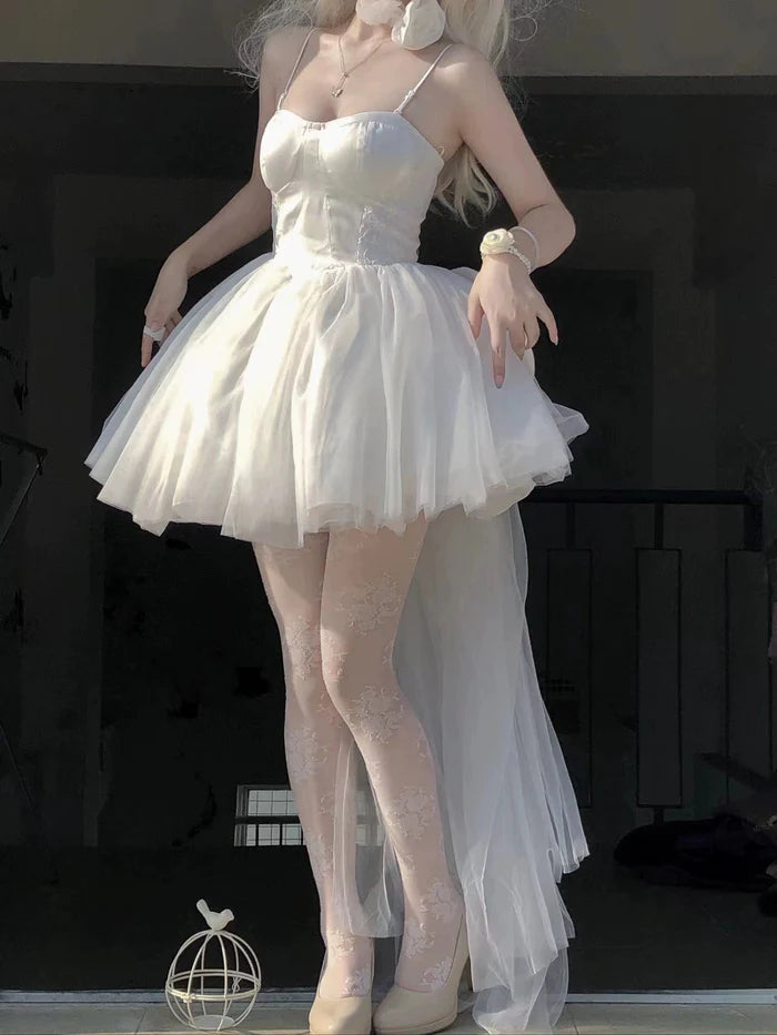 White A-line homecoming dress with spaghetti straps and V-neck.
