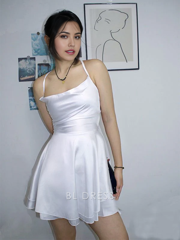 Elegant white A-line mini dress with spaghetti straps.
