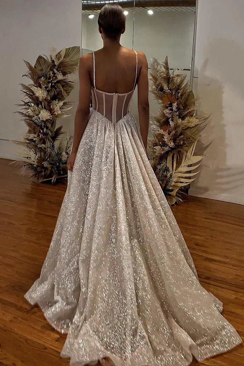 Back view of the A-line wedding dress, showing the flowing skirt and delicate spaghetti straps.