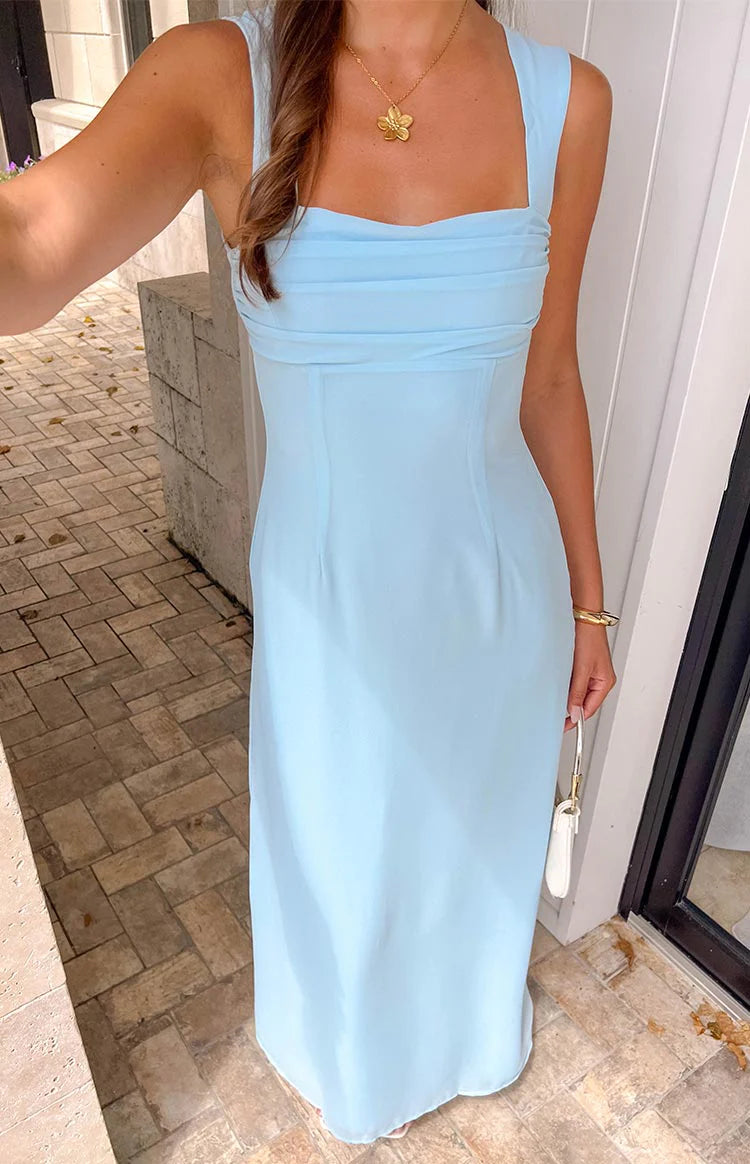 Back view of the light blue A-line maxi dress, showcasing ruched details and flowing skirt.