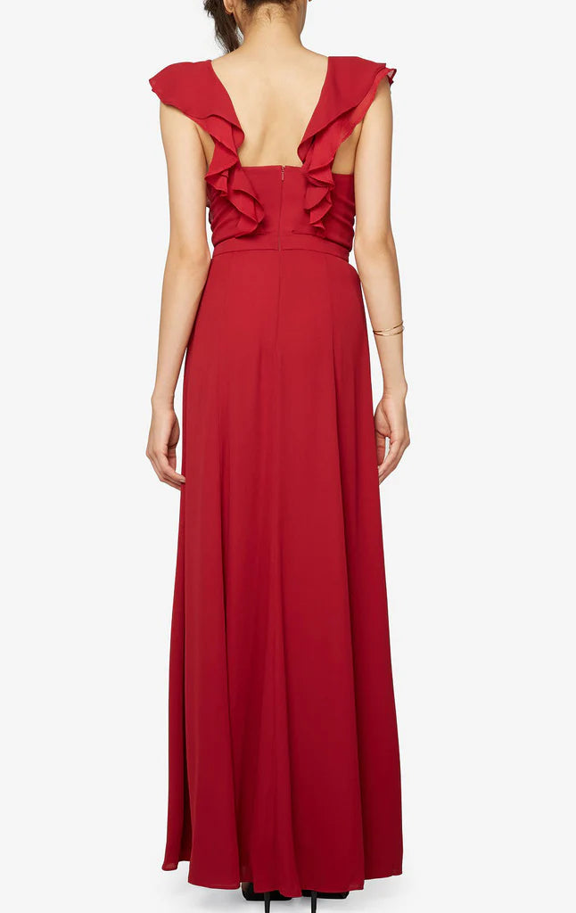 Close-up of the V-neckline and ruffled bodice of the chiffon formal gown.