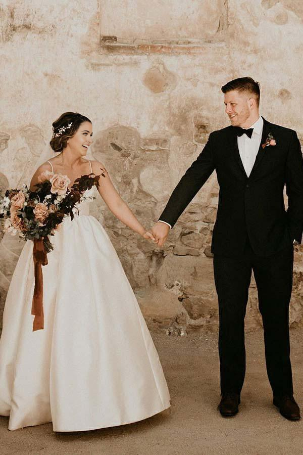 Side view of the ivory A-line wedding dress, showing the flowing skirt.
