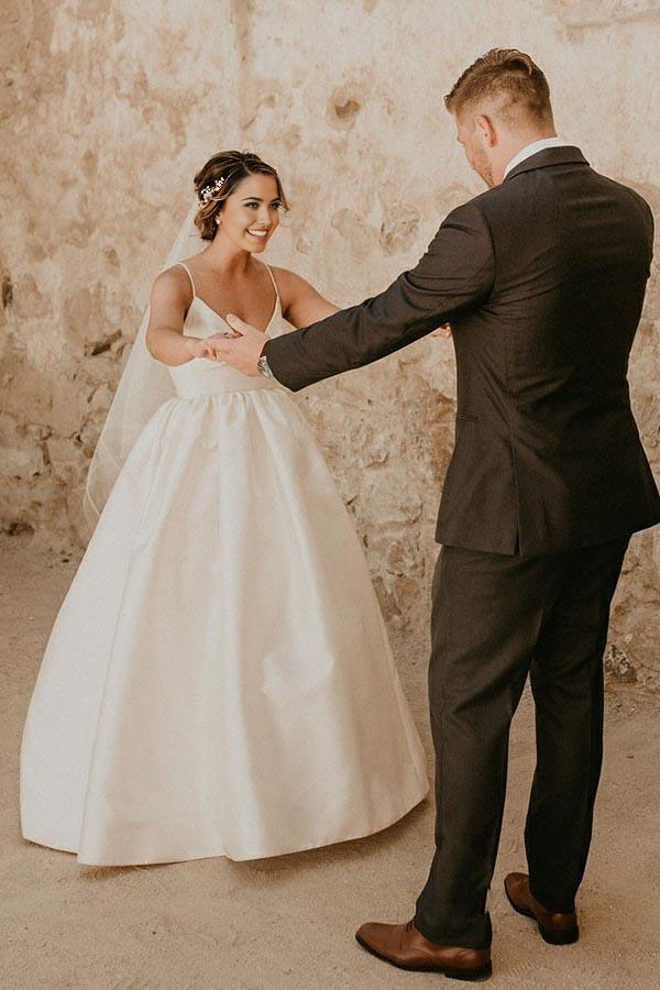 Back view of the ivory A-line wedding dress, highlighting the elegant silhouette.