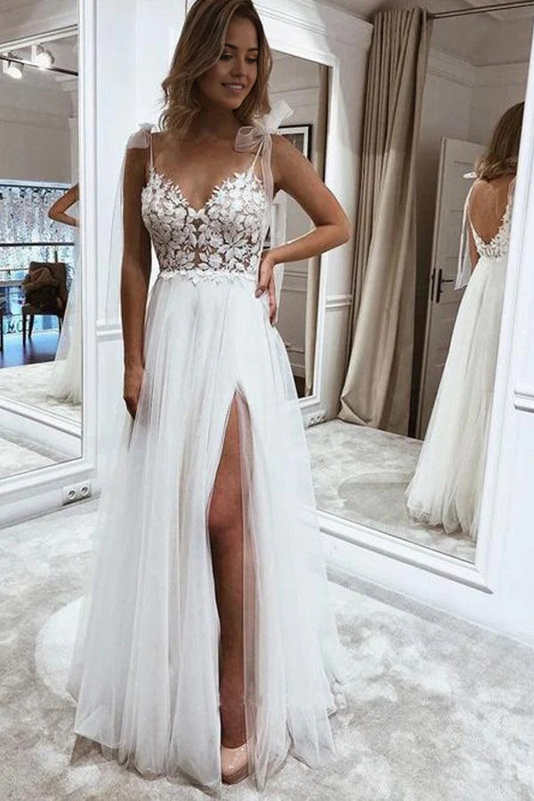 Elegant A-line V-neck wedding dress with lace and tulle details, featuring a front split.