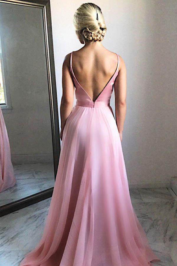 Back view of a flowing pink chiffon prom dress with a sweep train.