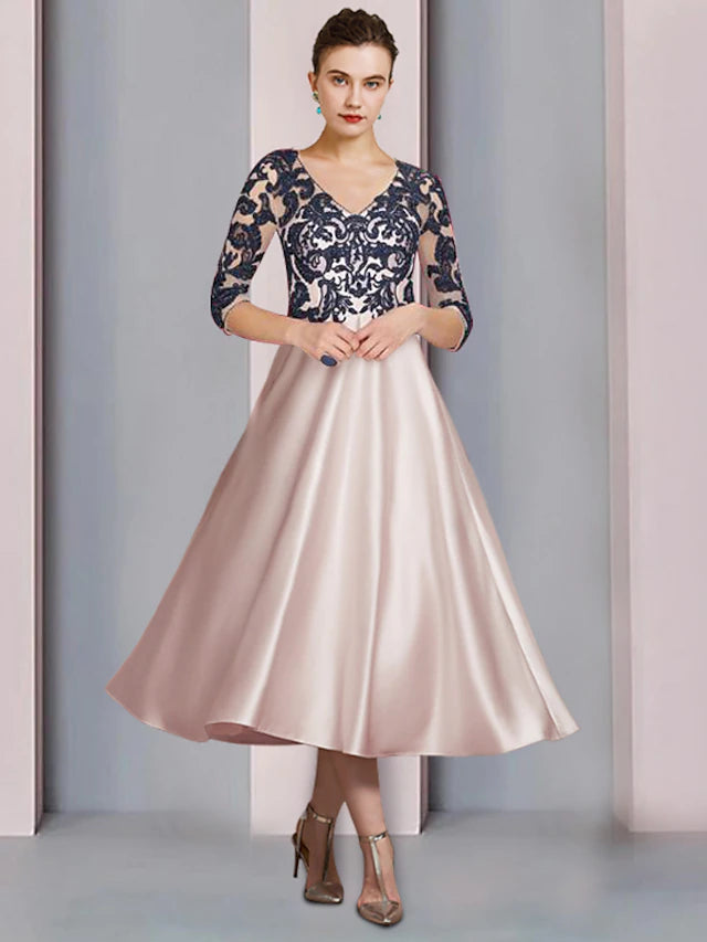 Elegant A-line Mother of the Bride dress with V-neck, 3/4 sleeves, and lace appliques.