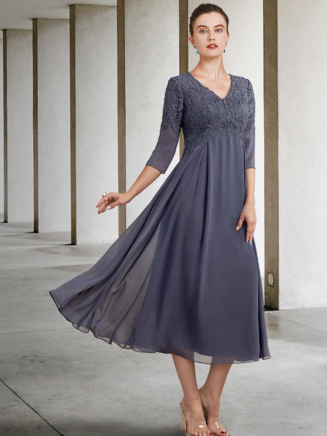 Elegant A-Line Mother of the Bride dress, V-neck, tea length, with 3/4 lace sleeves and ruffles.