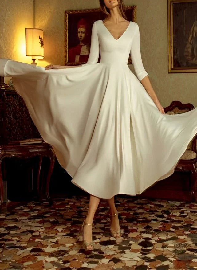 Model wearing an elegant A-Line V-Neck tea-length wedding dress, front view.