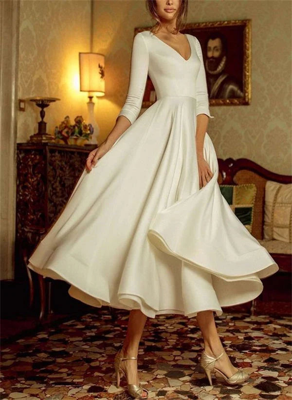 Close-up of the A-Line V-Neck tea-length wedding dress, showing V-neckline and fabric detail.