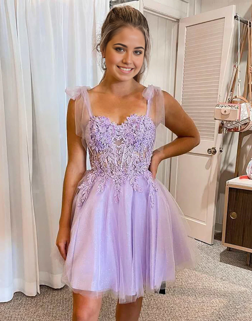 Elegant A-line short formal dress with tie straps and appliques.